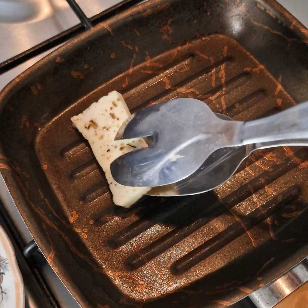 placing halloumi on the grill