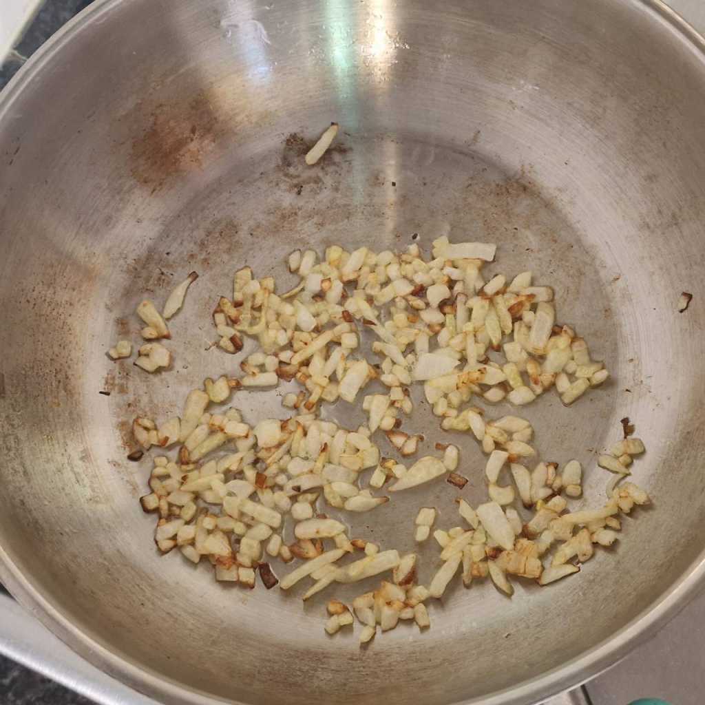 chopped onion frying in olive oil