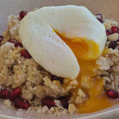 Poached egg with oatmeal and parmesan cheese