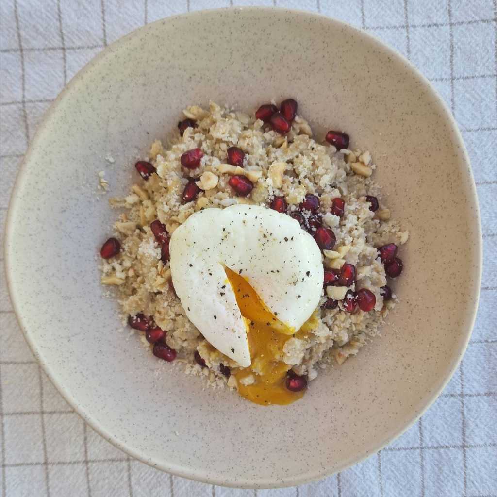 Savory Oatmeal with a Poached Egg, Parmesan cheese, pomegranate seeds