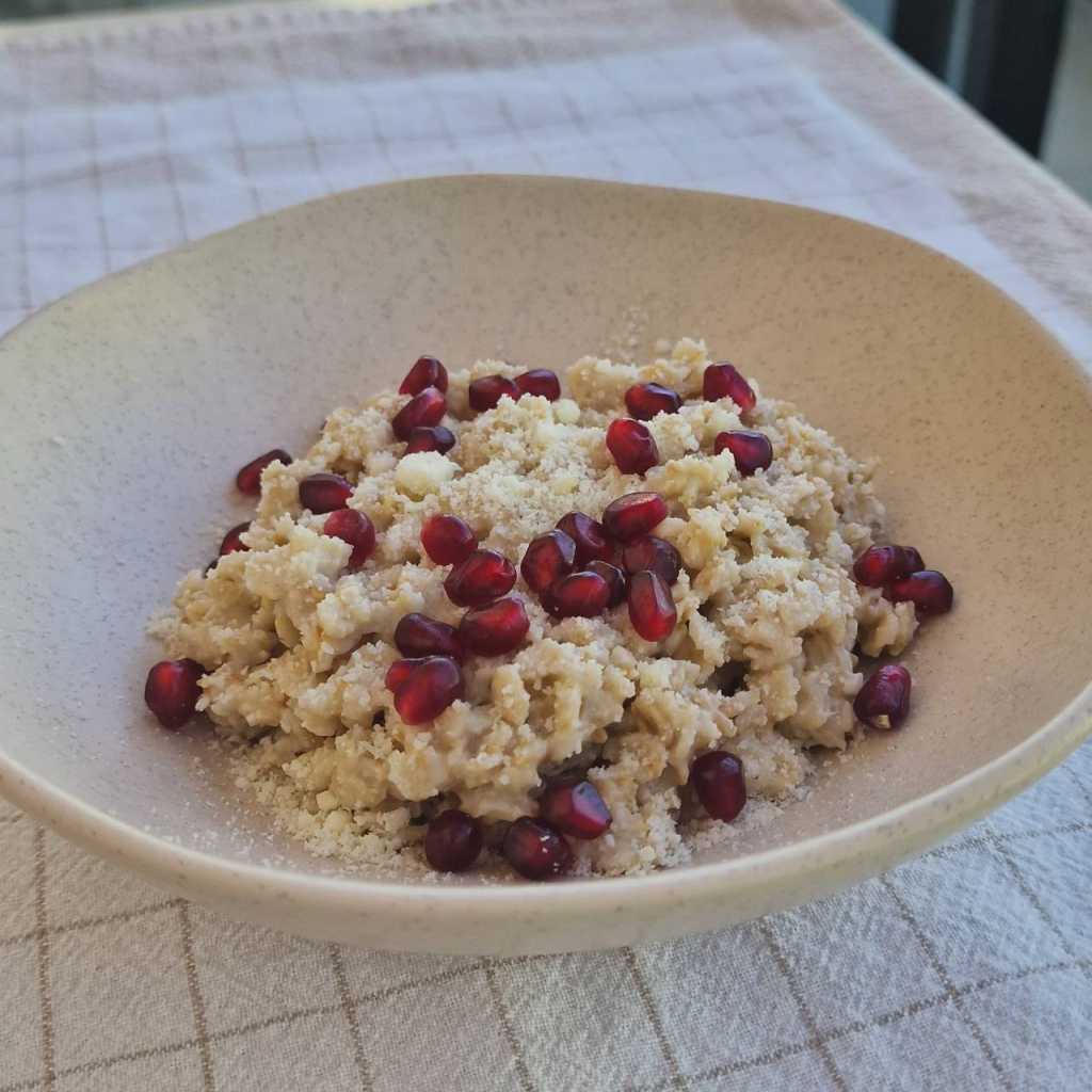 Savory Oatmeal with a Poached Egg, Parmesan cheese, pomegranate seeds recipe