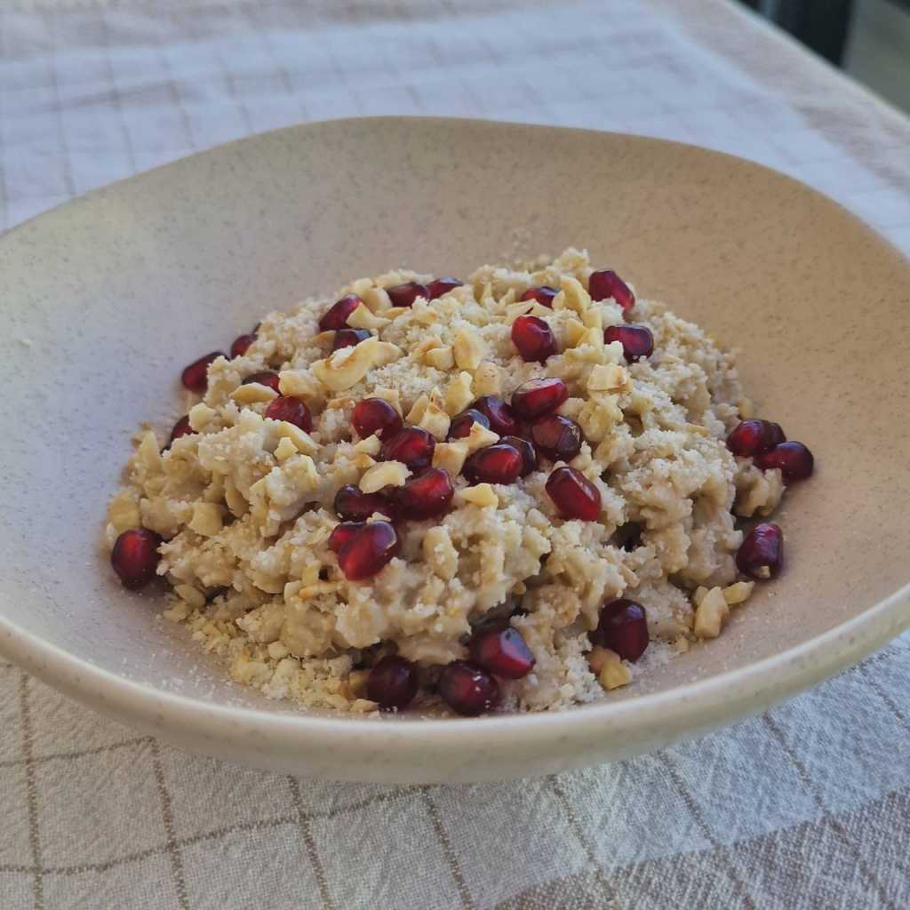 Savory Oatmeal with a Poached Egg, Parmesan cheese, pomegranate seeds recipe