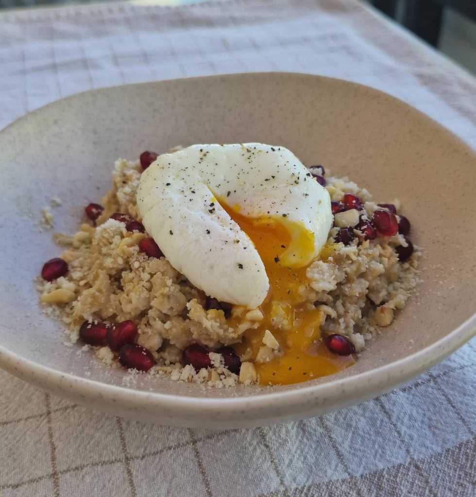 Savory Oatmeal with a Poached Egg, Parmesan cheese, pomegranate seeds recipe