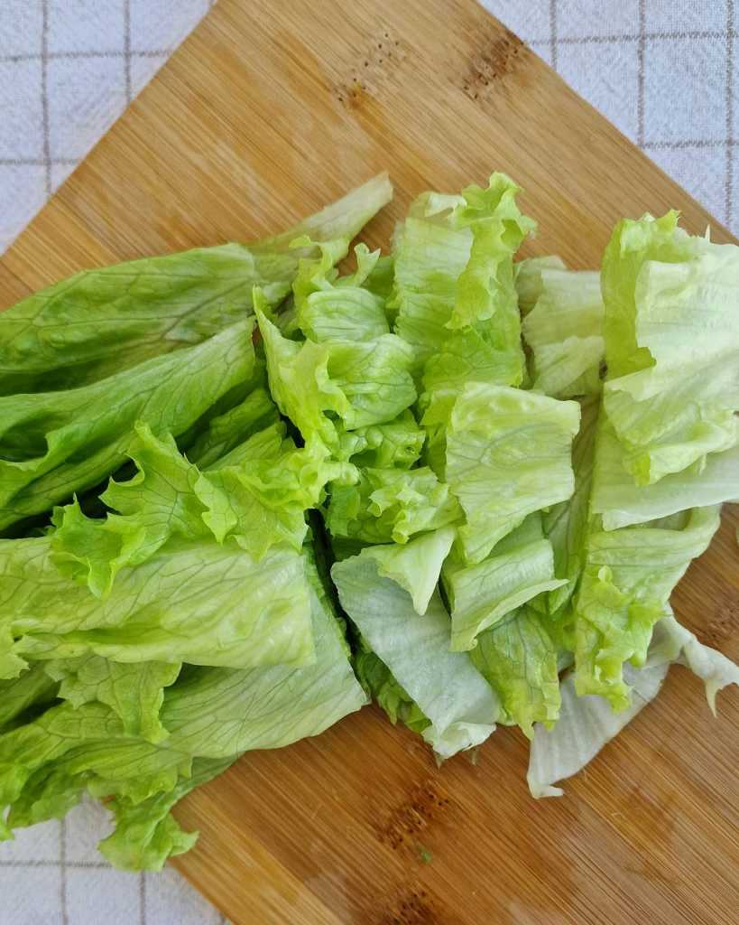 cut Batavia lettuce for Citrus Salad recipe