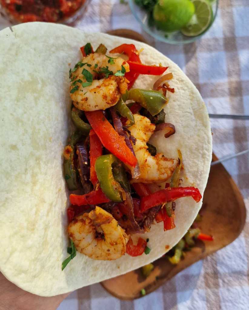 Sheet Pan Shrimp Fajitas recipe on tortilla