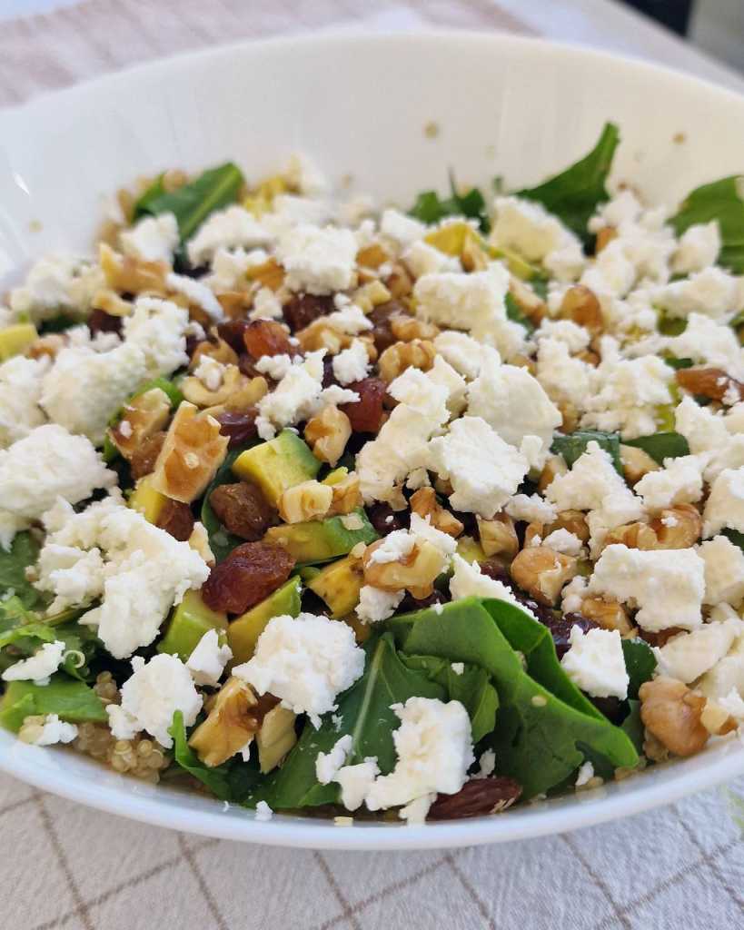 Superfoods Quinoa Salad with walnuts, raisins, avocado and feta cheese