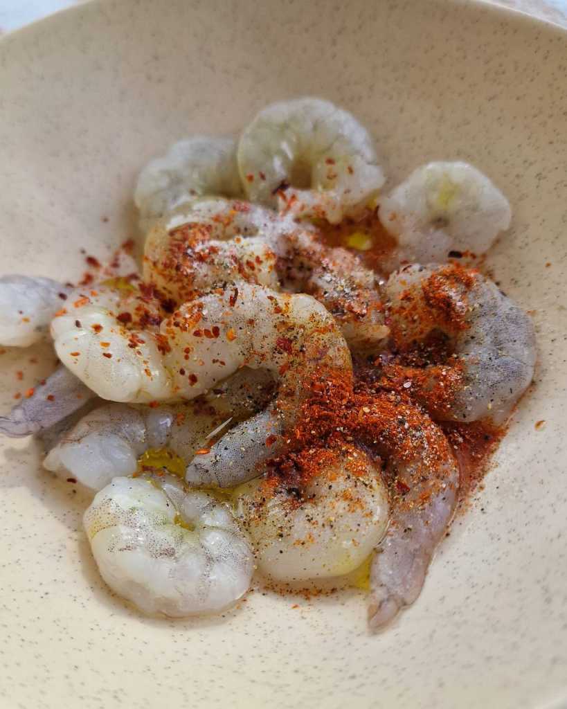 Quinoa bowl with shrimp with paprika, oranges, avocado, and cucumbers recipe