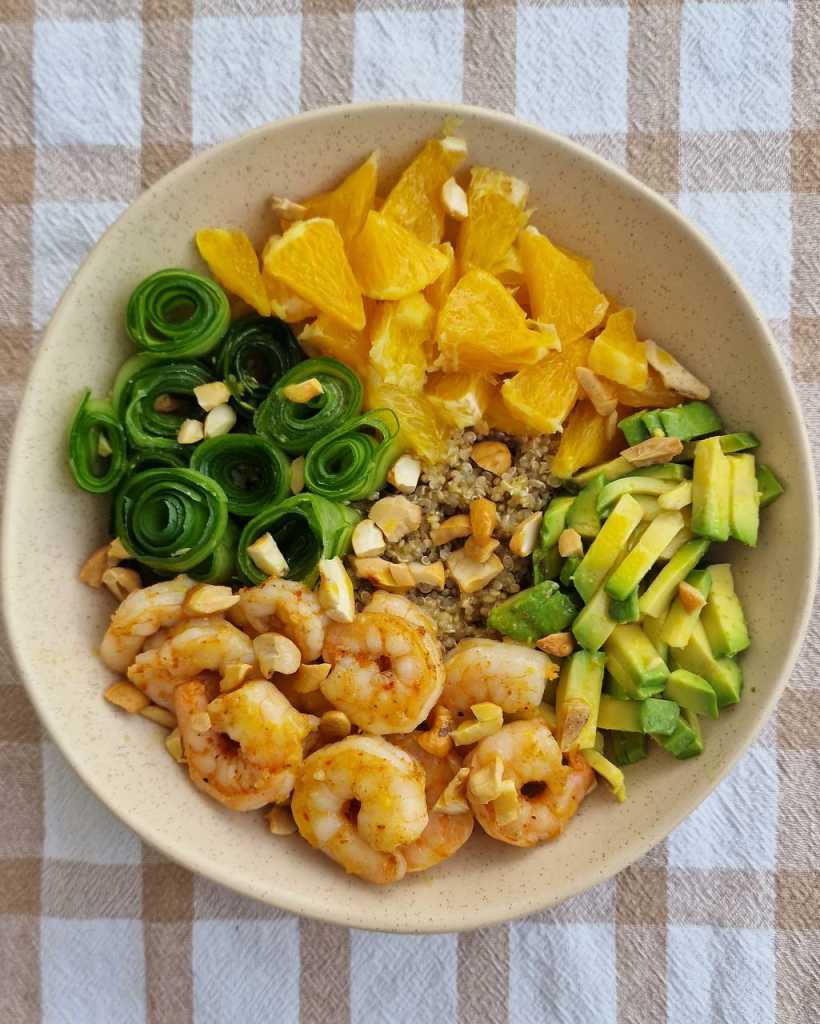 Quinoa bowl with shrimp, oranges, avocado, and cucumbers recipe