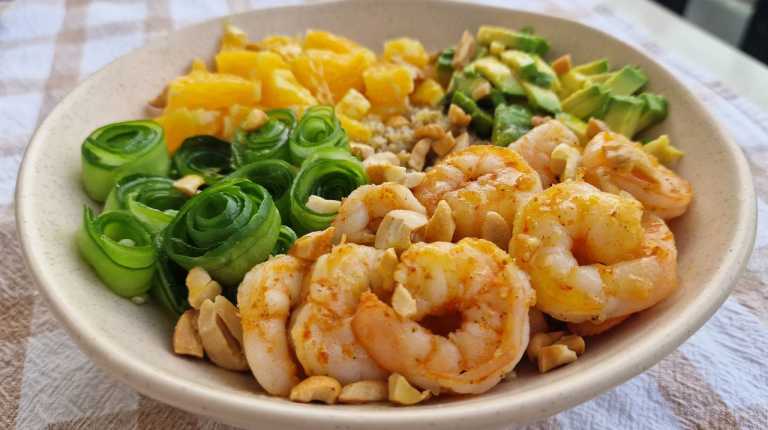Quinoa bowl with shrimp, oranges, avocado, and cucumbers recipe