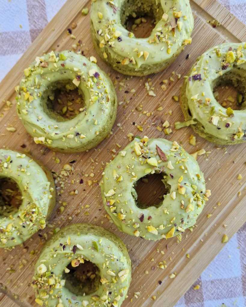 baked pistachio donuts with chocolate glaze