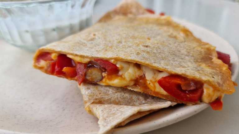 vegetarian quesadilla with bell peppers, beans and cheese