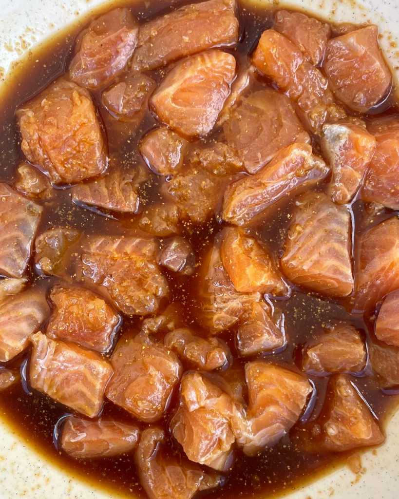 marinating Salmon Bites in Teriyaki Sauce