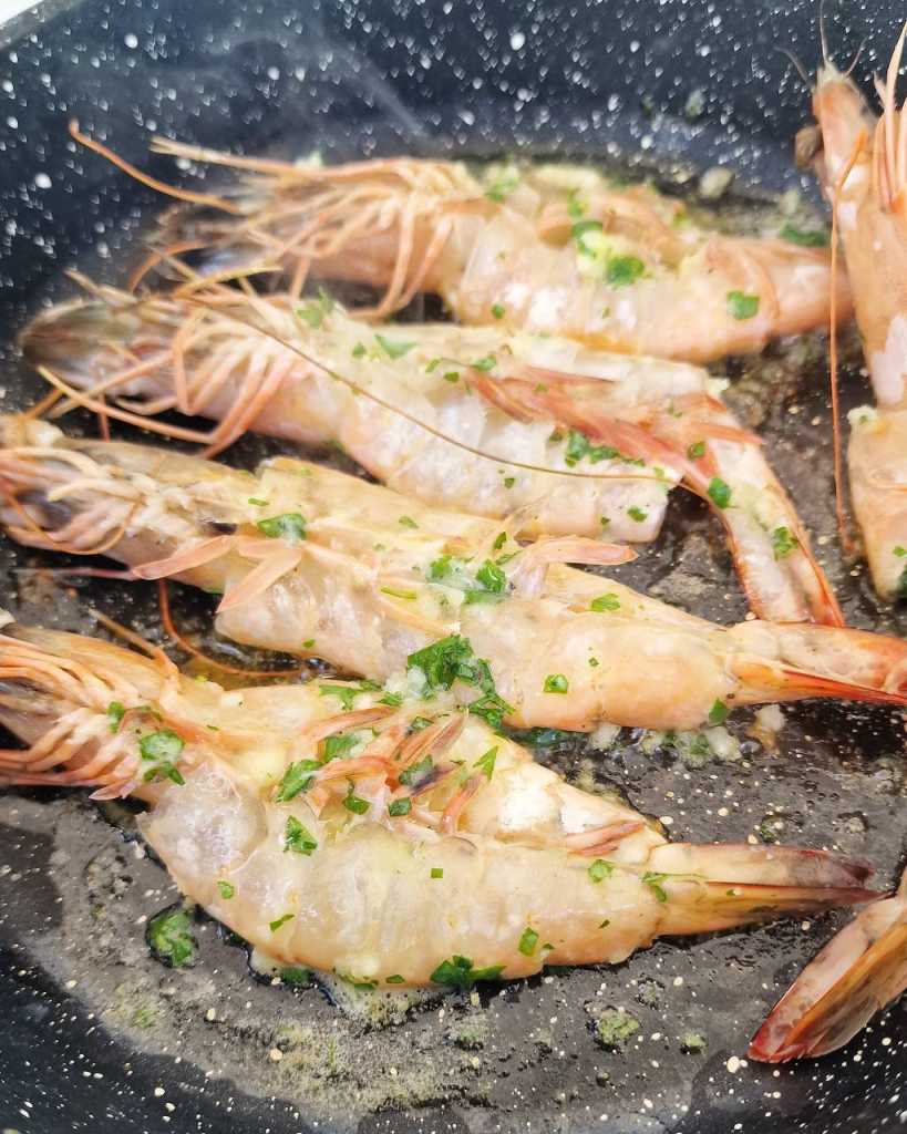 cooking garlic butter prawns