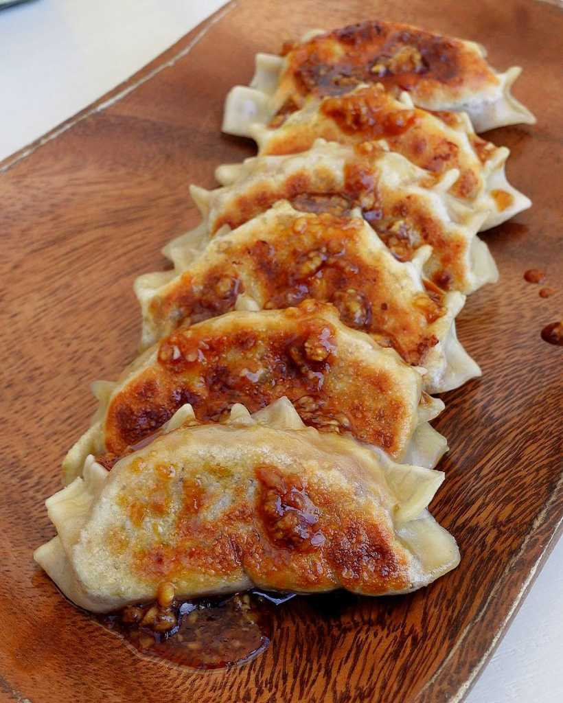 vegetarian gyoza in sauce