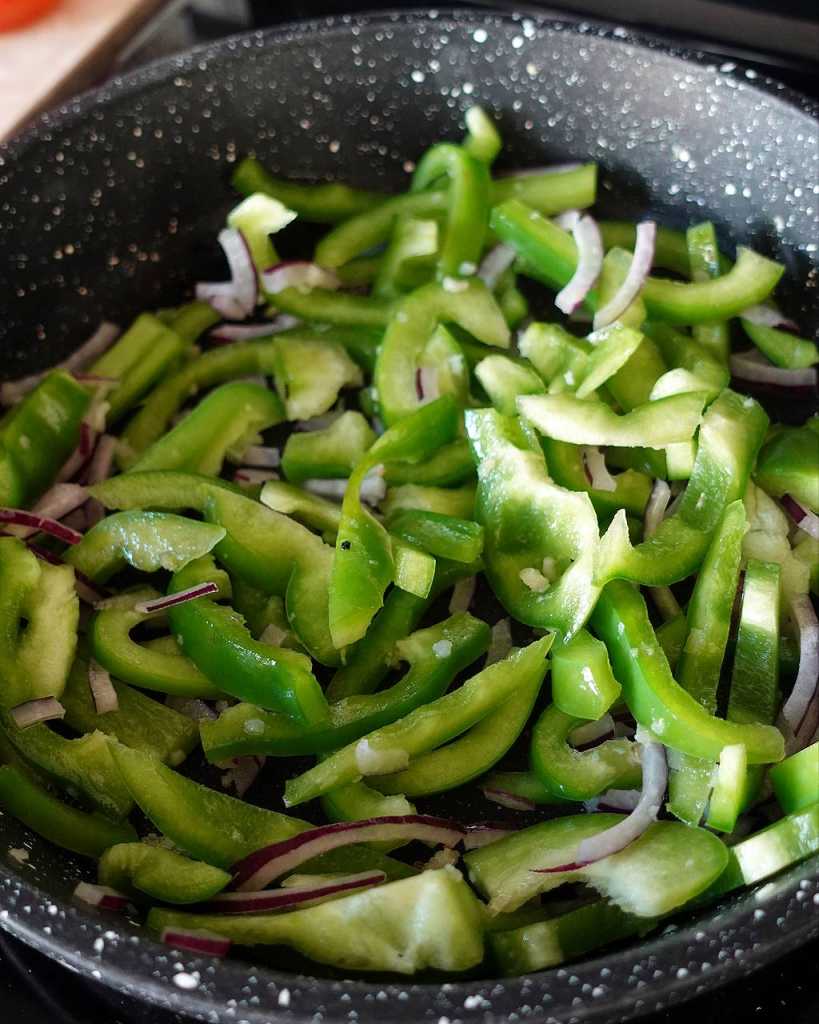 stir-fry bell peppers and onion