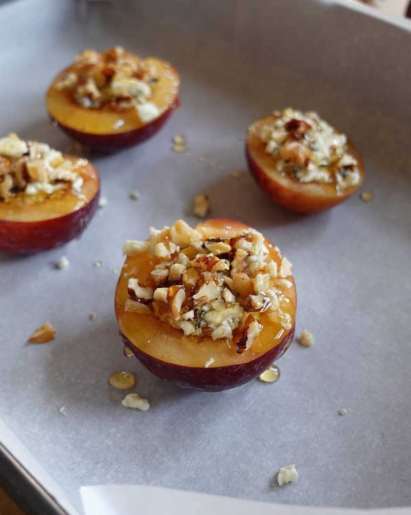 making Baked Plums With Blue Cheese
